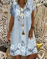 V-ringad avslappnad klänning i blommönster med kort ärm